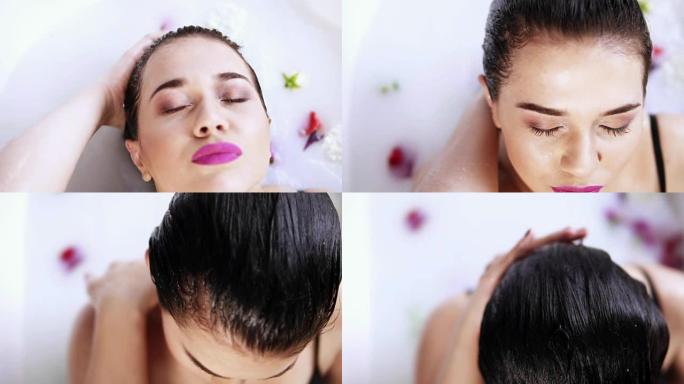 年轻女子头部沐浴在盛满鲜花的牛奶浴中的特写镜头。水疗和护肤概念。慢动作镜头