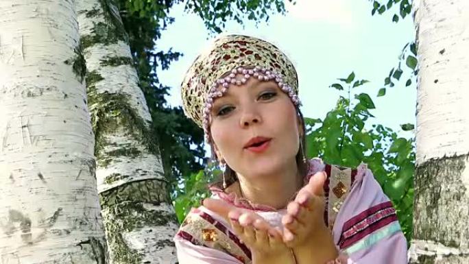 空中用桦木亲吻一个年轻的俄罗斯女孩
