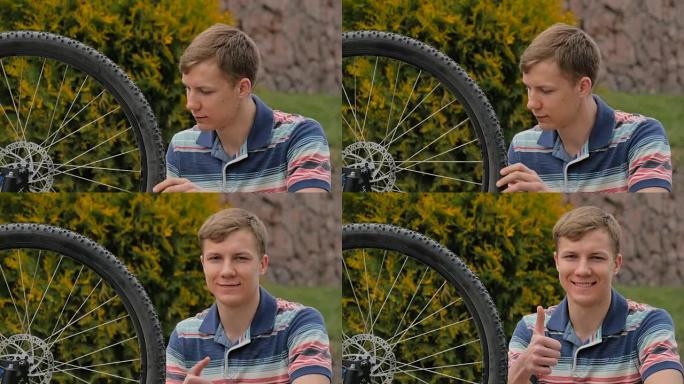 这个年轻人转动自行车的轮子。