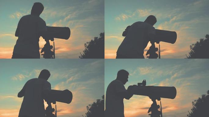 男人用望远镜看着星星。