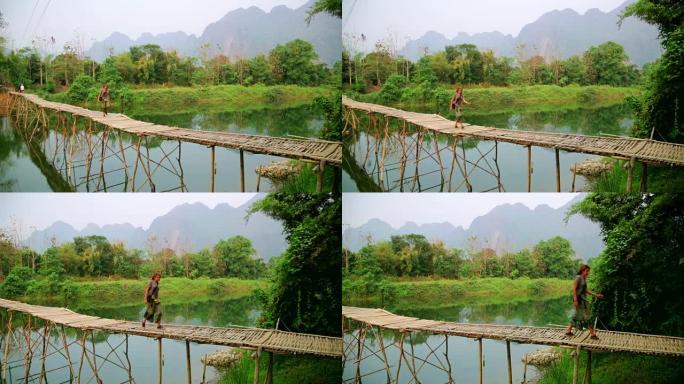走在竹桥上的旅游女孩，旺旺，老挝