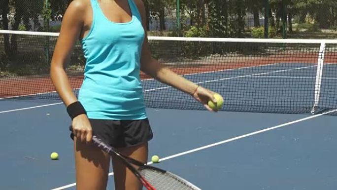 女人用网球拍打球