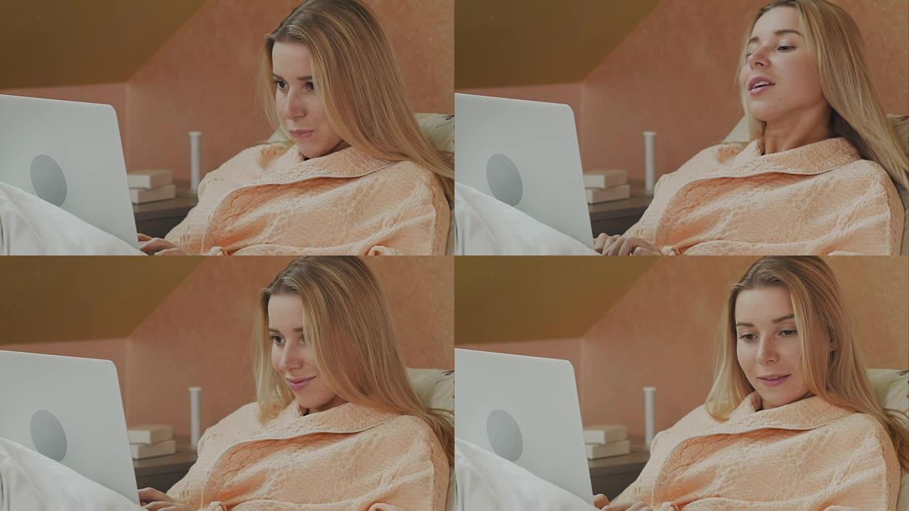 医院床上使用笔记本电脑的女性患者的全长侧视图