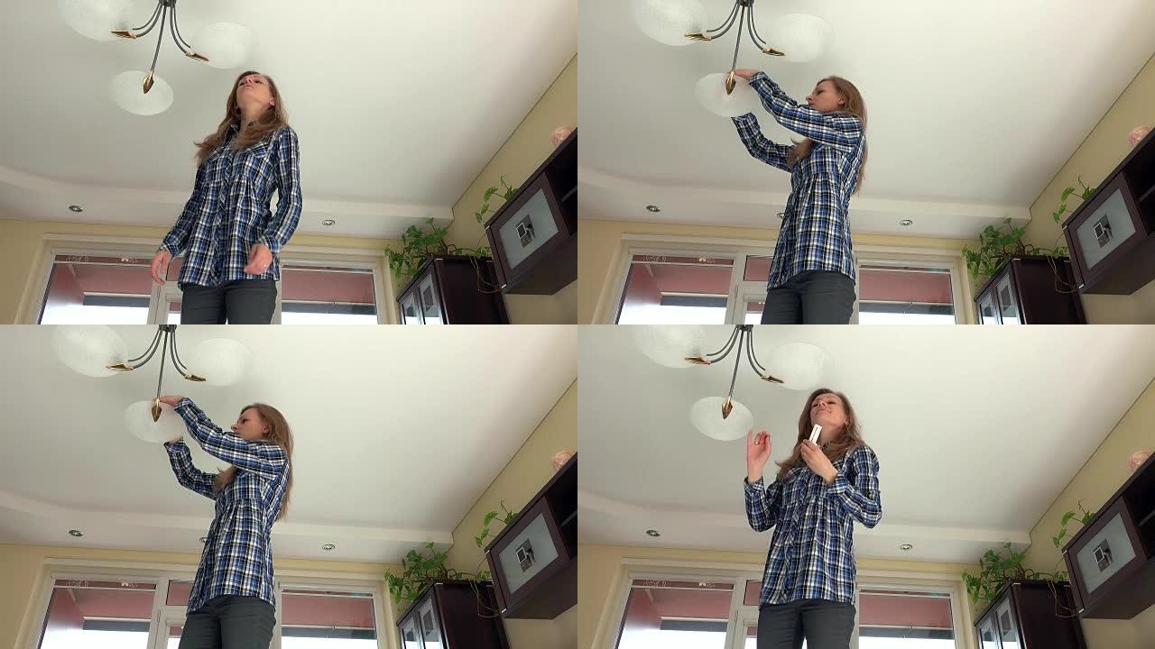 管家女人爬上去，在吊灯里换灯泡。