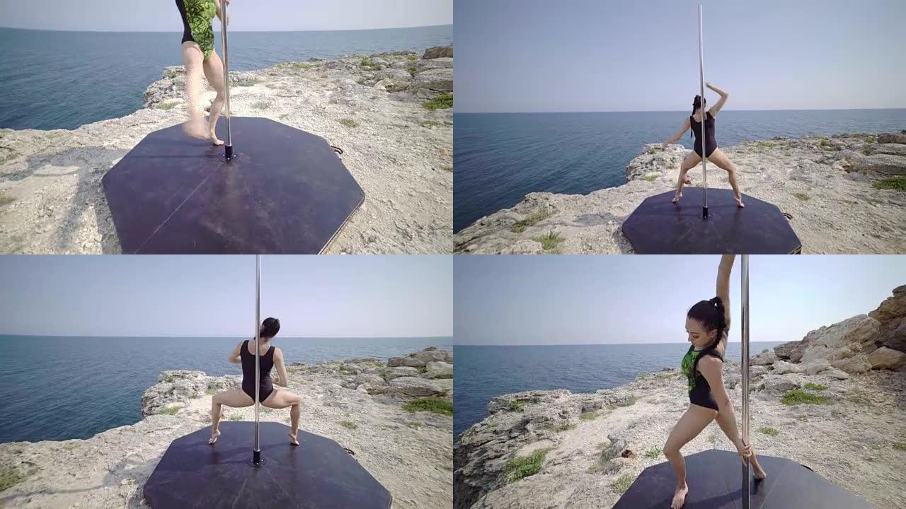 一名年轻女子在悬崖上使用便携式舞蹈和健身钢管。替身拍摄
