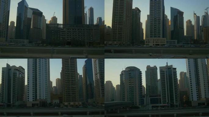 迪拜市著名的滨海购物中心地铁骑行侧日落全景4k阿拉伯联合酋长国