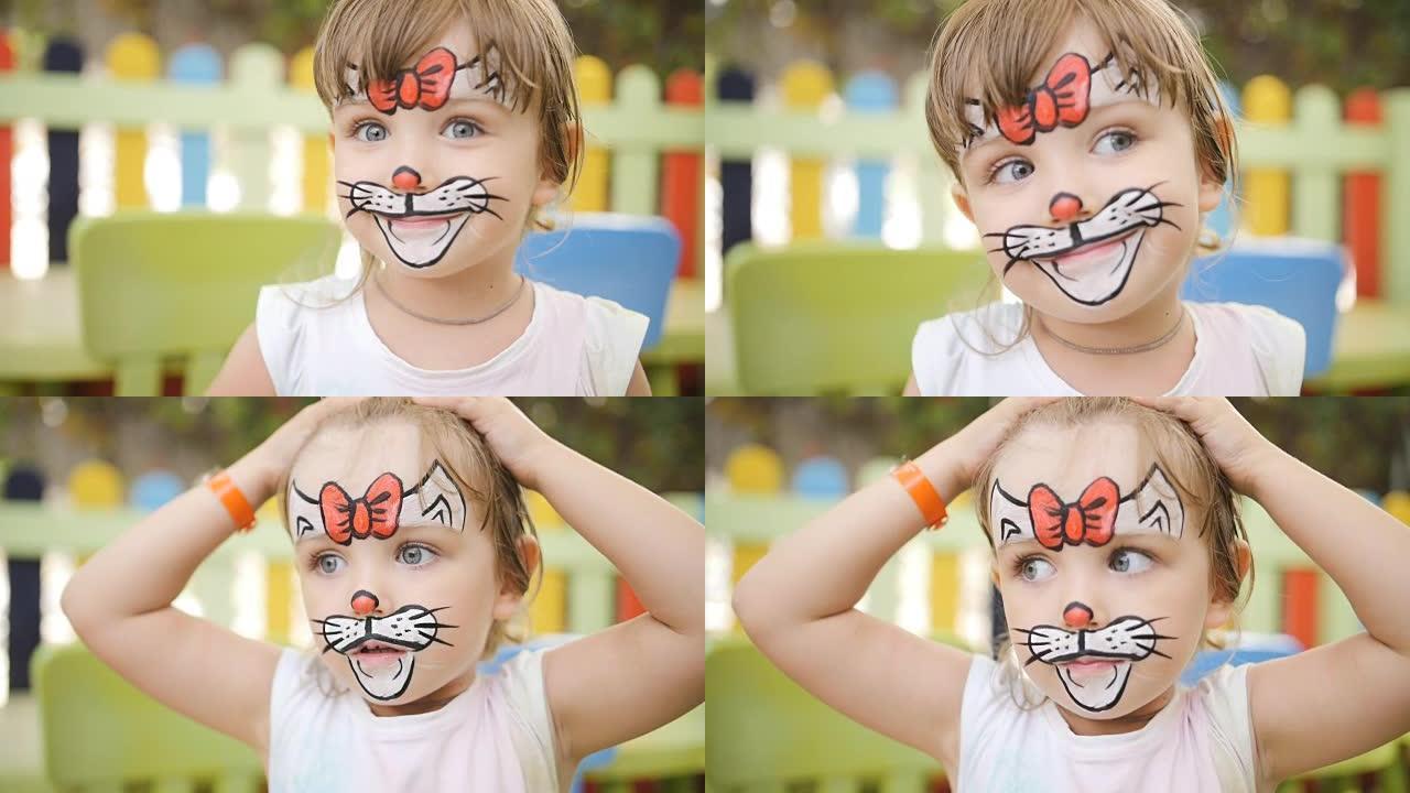 小女孩被画成狂欢节的猫