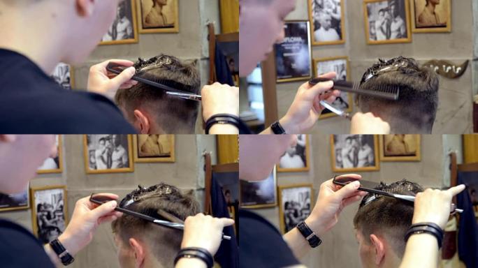 理发师在理发店用剪刀剪头发。特写