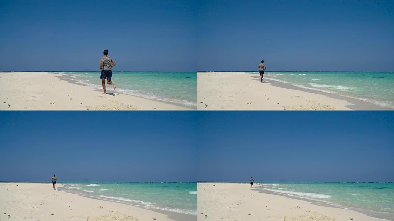 男子在沙滩上奔跑