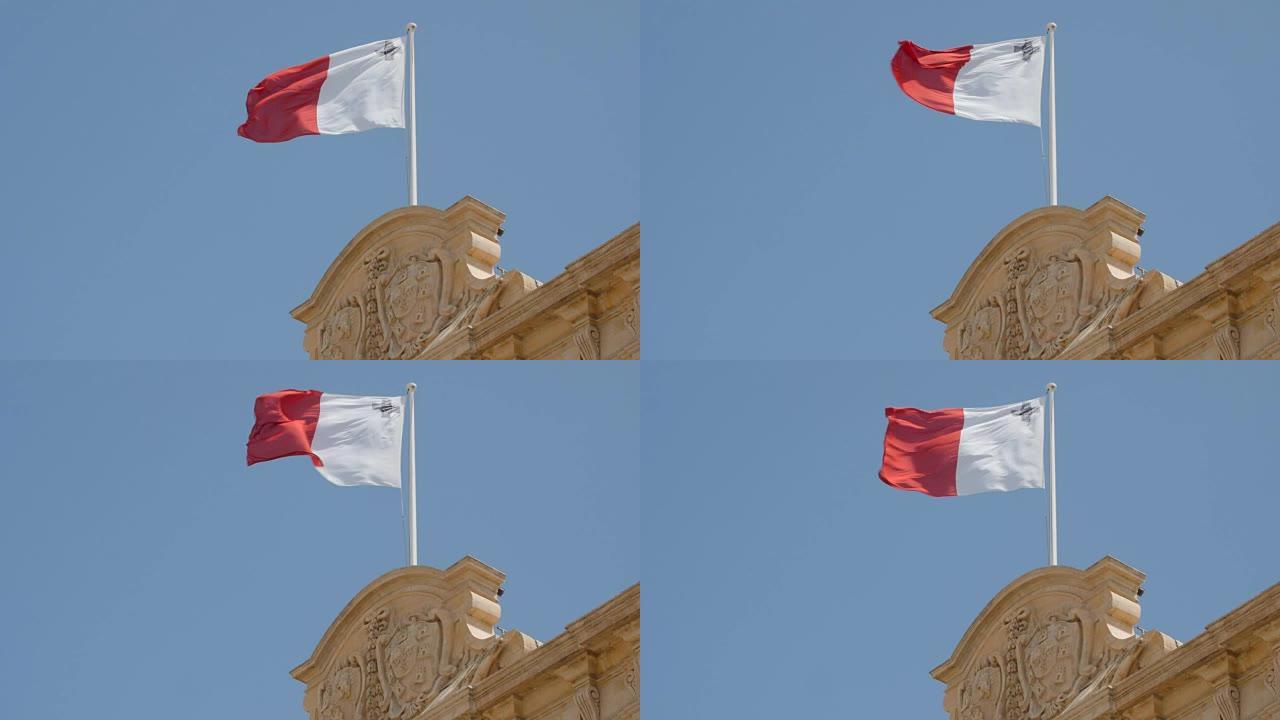马耳他国旗在蓝天前飘扬在旗杆上。FullHD镜头