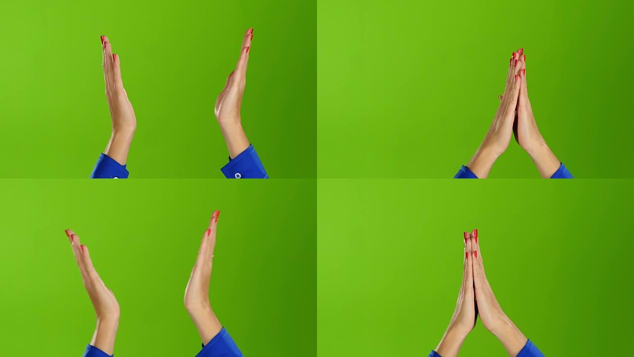 女性双手鼓掌伸直手腕。绿屏工作室