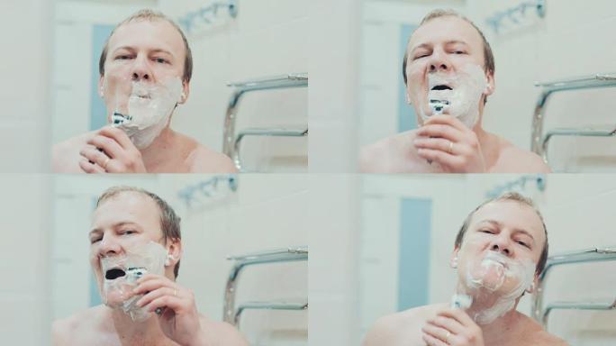 一个男人在浴室里剃毛。慢动作