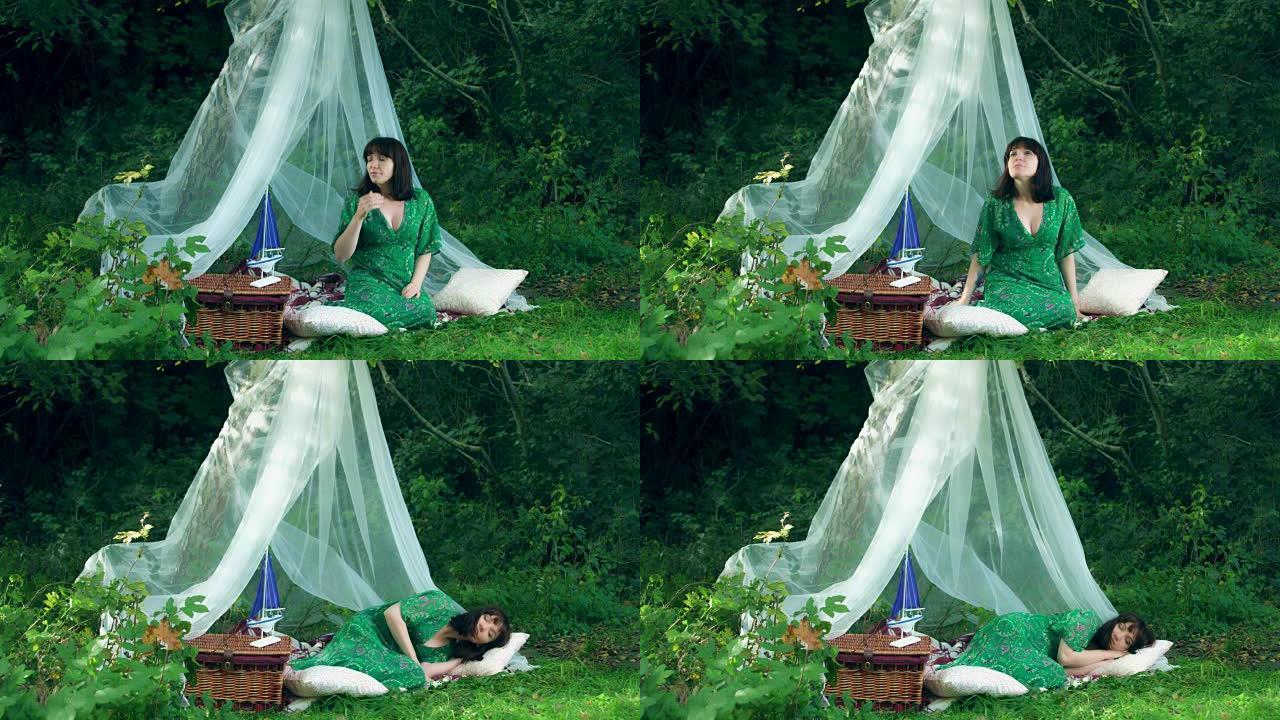 4k自然拍摄一名妇女在森林庇护所睡觉的照片