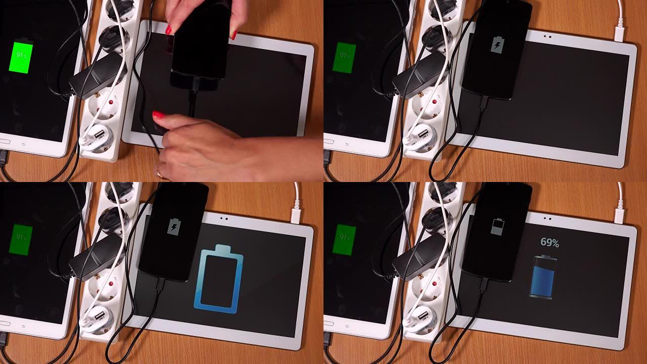 用手将平板电脑和电话插入扩展插座中的充电器
