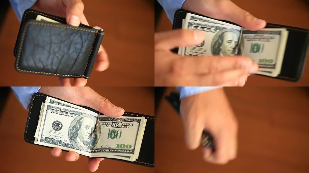 男子双手握有美元的钱夹