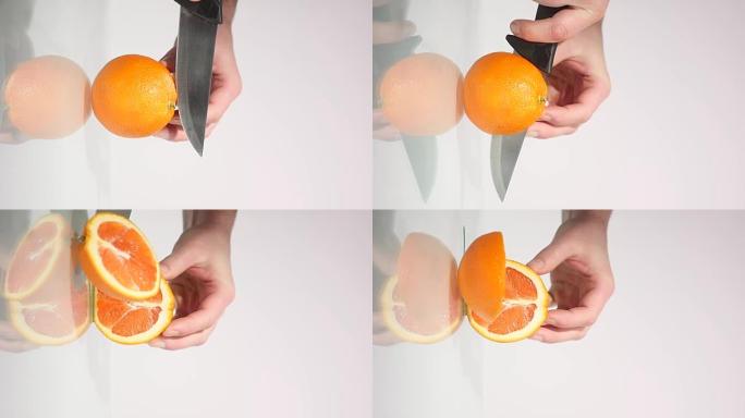 切半个橘子，新鲜水果，用刀切，一个橘子特写，橘子，健康的生活方式