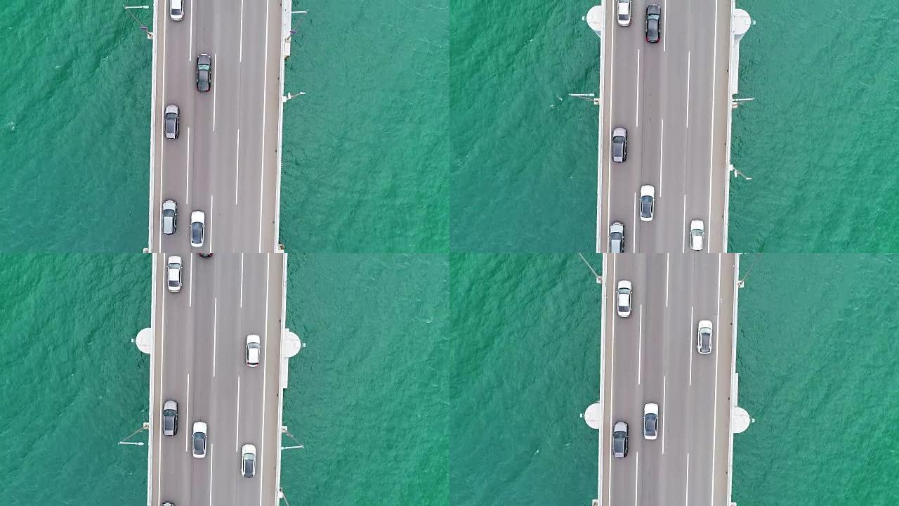 釜山海滩上的广安桥上的汽车航拍。