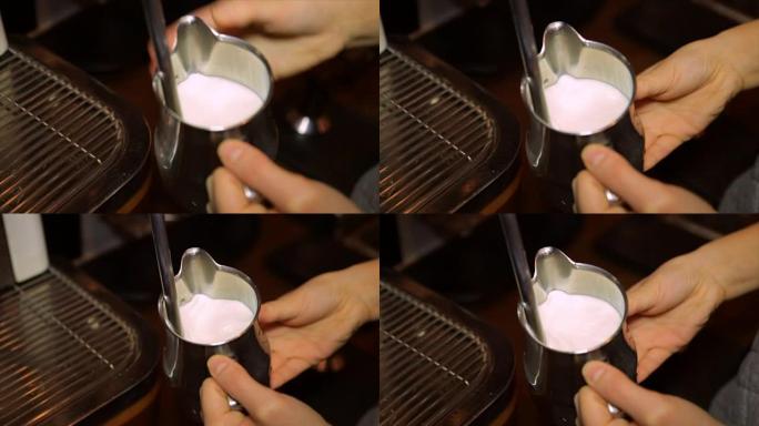 咖啡师在专业的咖啡机上搅拌牛奶