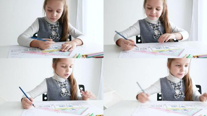 Little girl drawing a picture on white room. 7 yea
