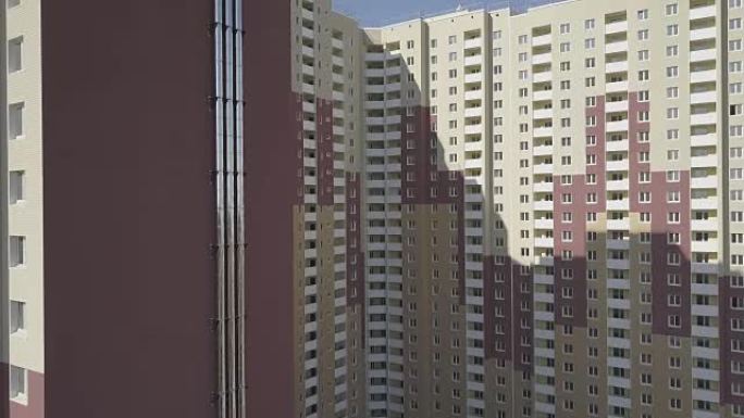 鸟瞰图。城市中一座新的高层公寓楼。在房屋管道的墙上进行绘图