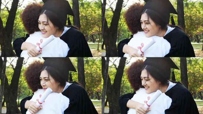 年轻的亚洲女学生在大学里戴着毕业帽和礼服，有毕业概念的女人。女人带着幸福的心情拥抱母亲。