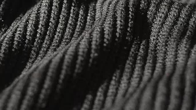 多莉黑色针织毛衣的照片。浅景深
