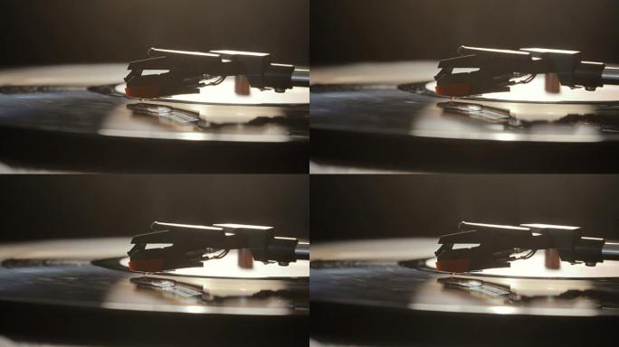 使用古旧黑胶唱机的特写。转盘播放器，在黑胶唱片播放中放下手写笔针