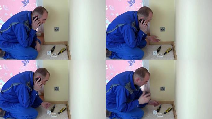 愤怒的电工工人男人说话现代手机