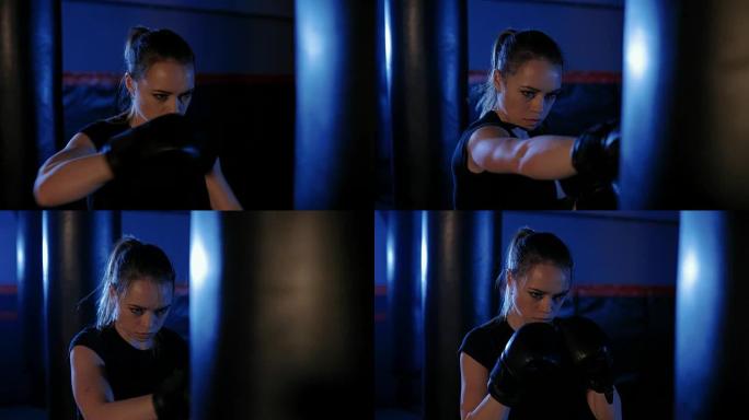 女孩是拳击。美丽的跆拳道女子训练沙袋。女斗士的拳头靠近。