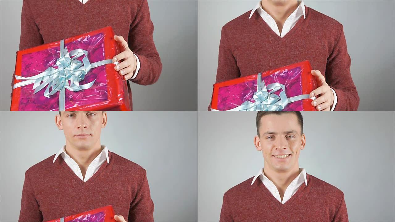 一个年轻人和一份礼物。一个有魅力的男人拿着一个盒子。