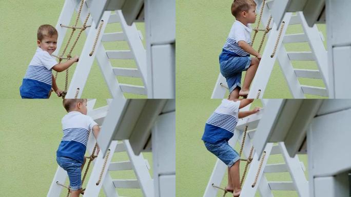 夏天，在花园里，孩子，一个四岁的男孩在操场上爬上孩子们的楼梯。一家人一起度过闲暇时光