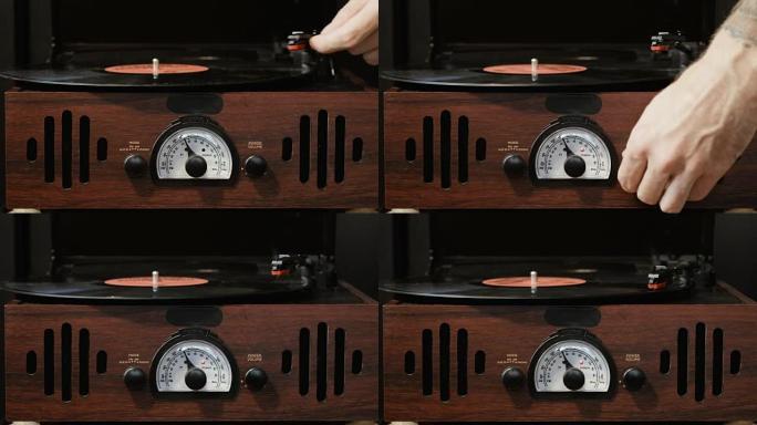 使用古旧黑胶唱机的特写。转盘播放器，在黑胶唱片播放中放下手写笔针