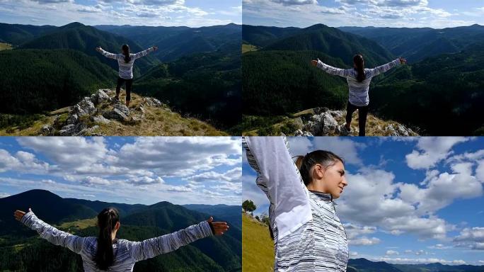女人举起手臂在山顶看日落的观点徒步女孩举起手臂庆祝生活风景自然景观享受假期旅行冒险