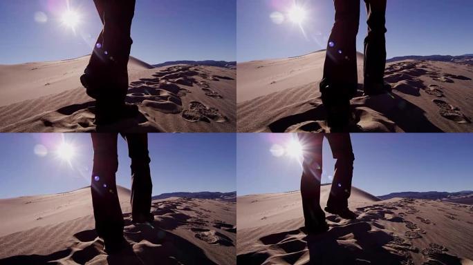 女性高加索徒步旅行者穿越沙漠沙丘