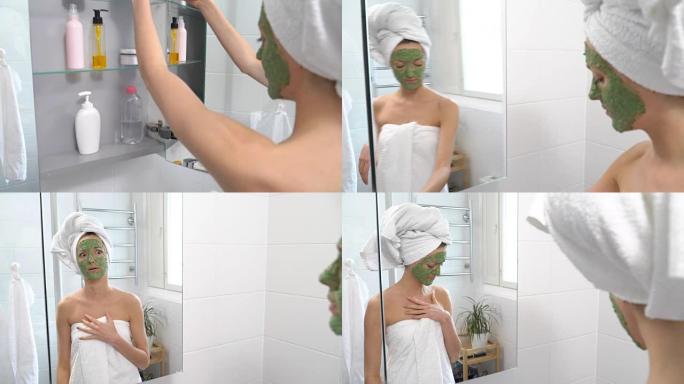 一个脸上戴着绿色保湿面膜的女人突然看到镜子里的自己，吓坏了