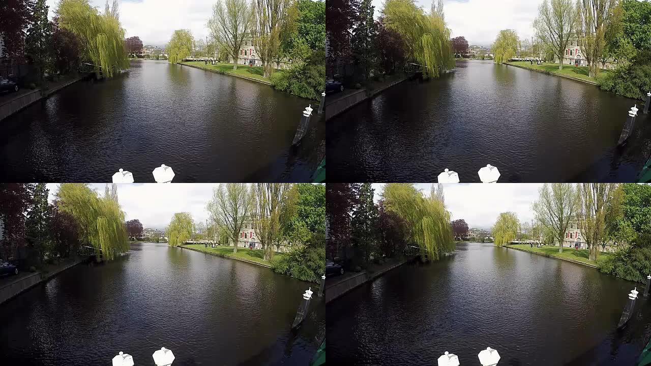 荷兰村庄的春季景观，带有运河和传统房屋