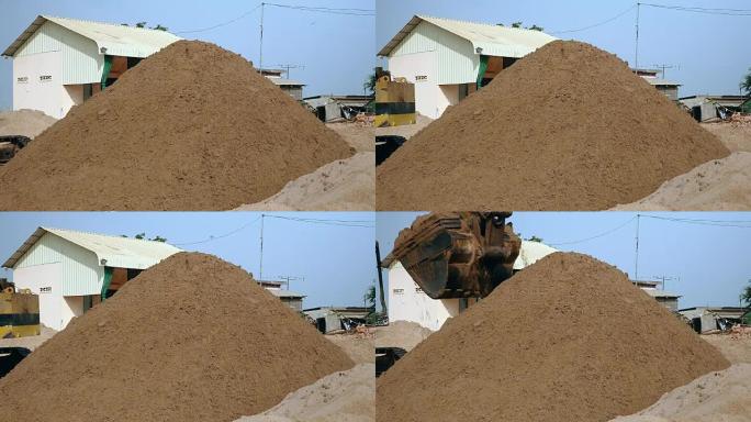 挖掘机在处置现场排放和堆沙 (特写)