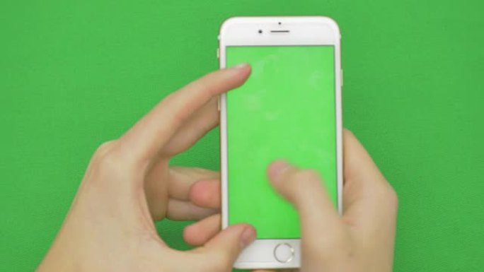 在绿屏上使用智能手机，各种手势，vertikal，特写-绿屏