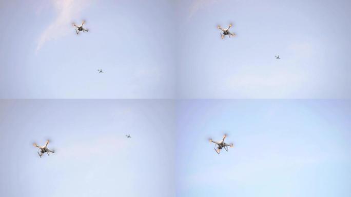 六架无人机在蓝天上飞翔。慢动作。3840x2160