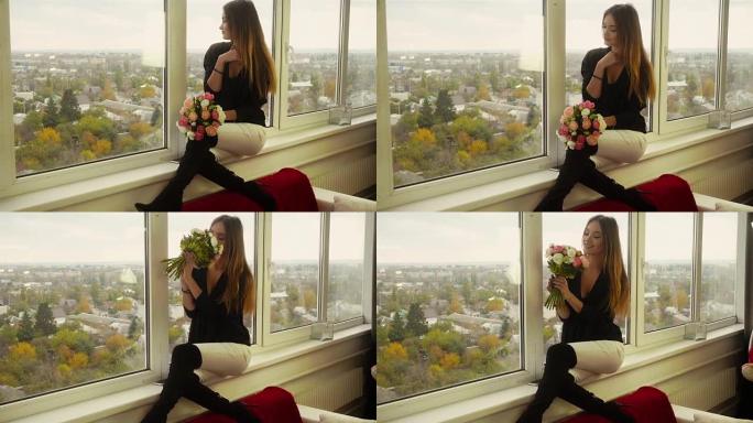 美丽的女士坐在窗台上，嗅着花朵