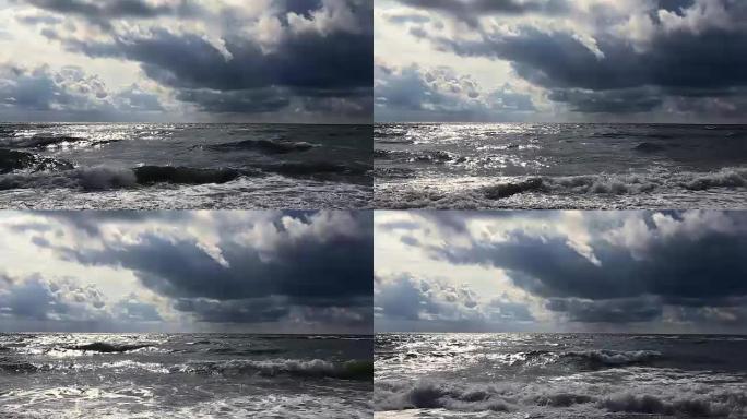 海上沙滩上的暴风雨，阴云密布，风追逐海浪和云层。