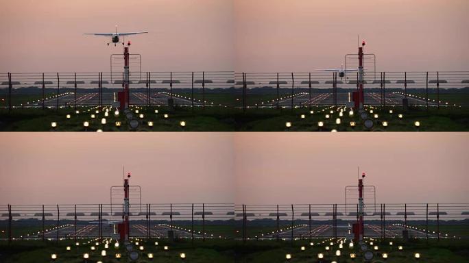 飞机降落在橙色日落天空的轮廓上