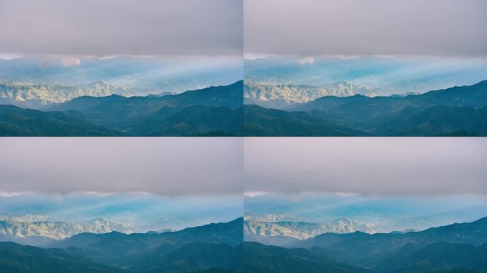 桂林资源县阳光透过云层照在山丘上延时摄影