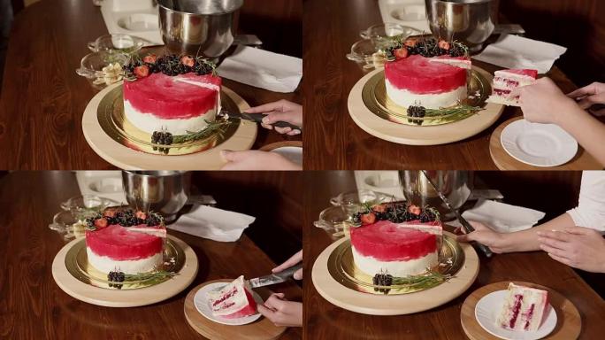 一个女人切的甜蛋糕的特写镜头，将其切成薄片放在盘子上