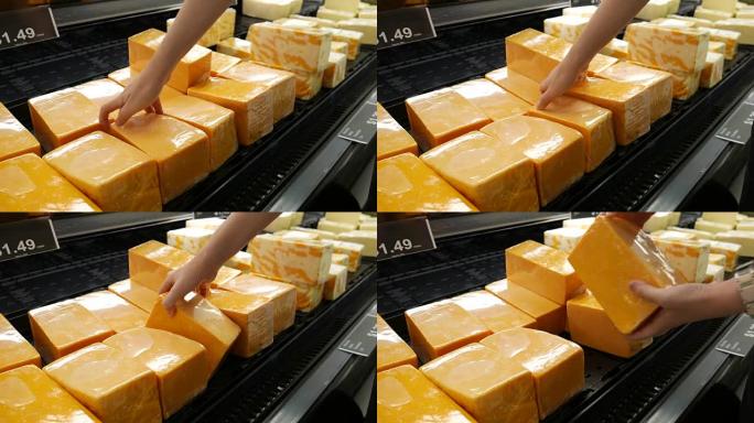 超市内女人手工采摘奶酪的动作