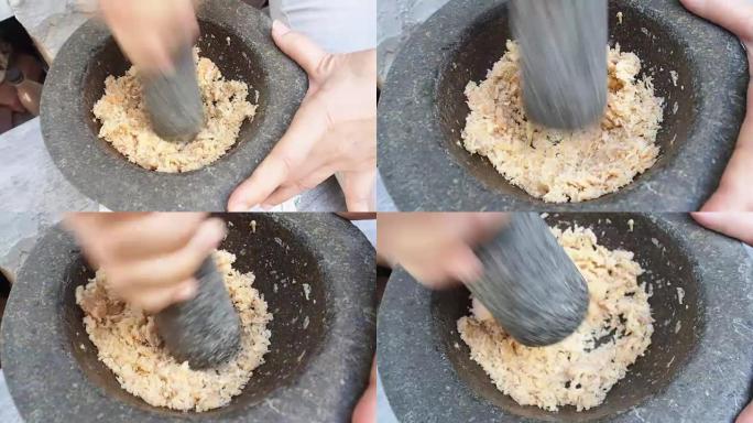 用传统的大理石砂浆捣碎干虾