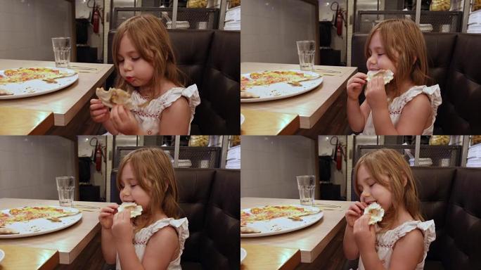 餐馆里的小女孩吞食披萨