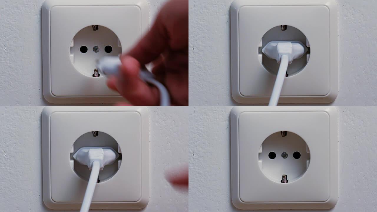用手将电源插头插入墙壁插座