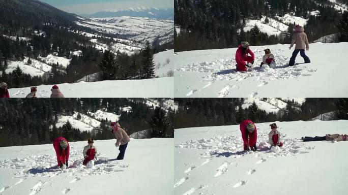 快乐的家庭在冬天在山上的白雪皑皑的森林里玩耍。妈妈和她的两个孩子扔雪球。他们在笑。