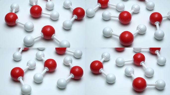 分子水科学元素的化学模型原子。在白色背景上分离的氢原子和氧原子的集成粒子。